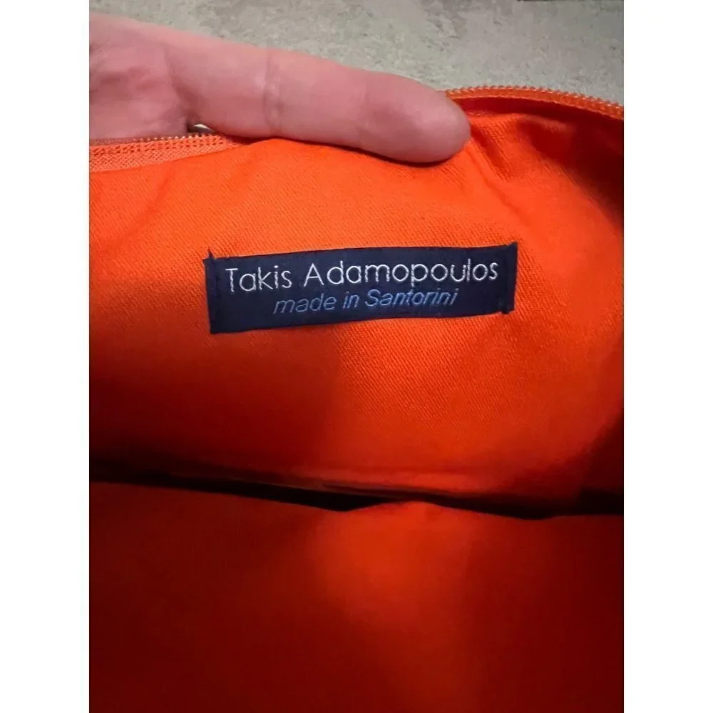 Takis Adamopoulos beautiful clutch